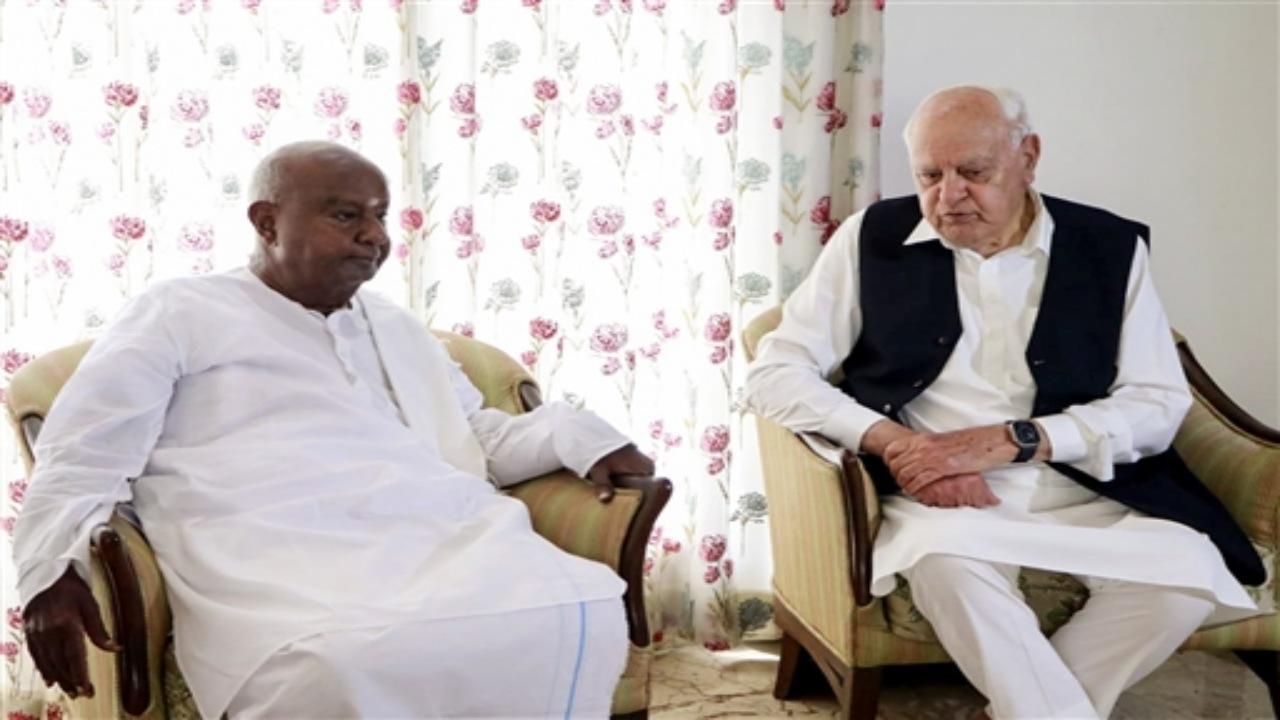 Jammu and Kashmir National Conference (NC) president Farooq Abdullah on Wednesday met with former Prime Minister and Janata Dal-Secular JD (S) president HD Deve Gowda in Bengaluru. Photos/ANI