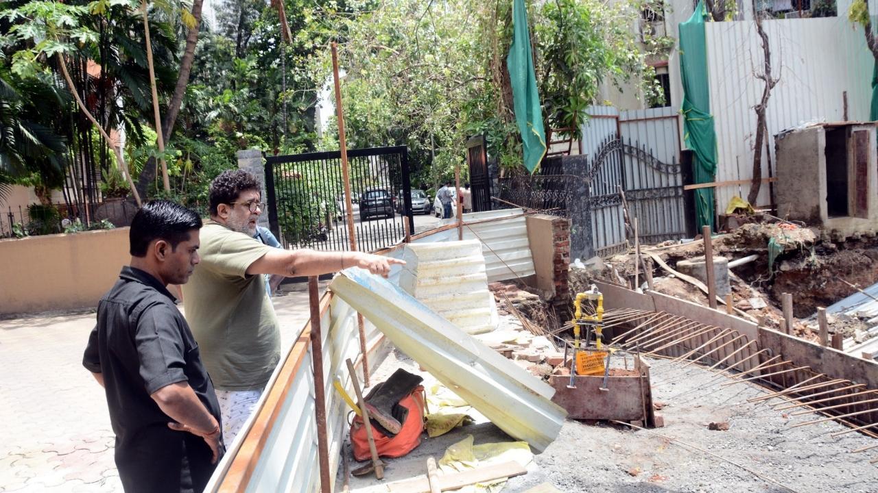 The builder working on the redevelopment next to the society has said he will get the compound wall and security guards’ cabin at Mota Mansion CHS repaired. Pics/Sayyed Sameer Abedi