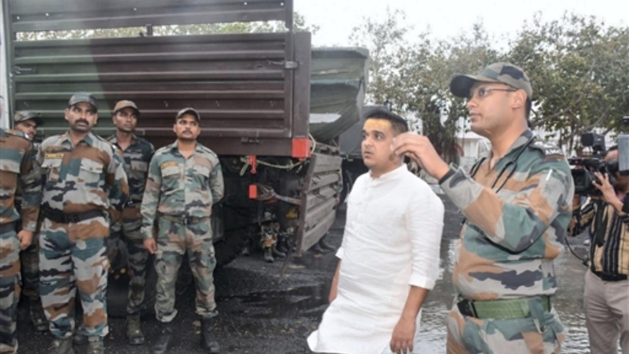 Gujarat Minister Harsh Sanghvi interacts with Indian Army personnel during a visit to inspect damages following the landfall of Cyclone Biparjoy