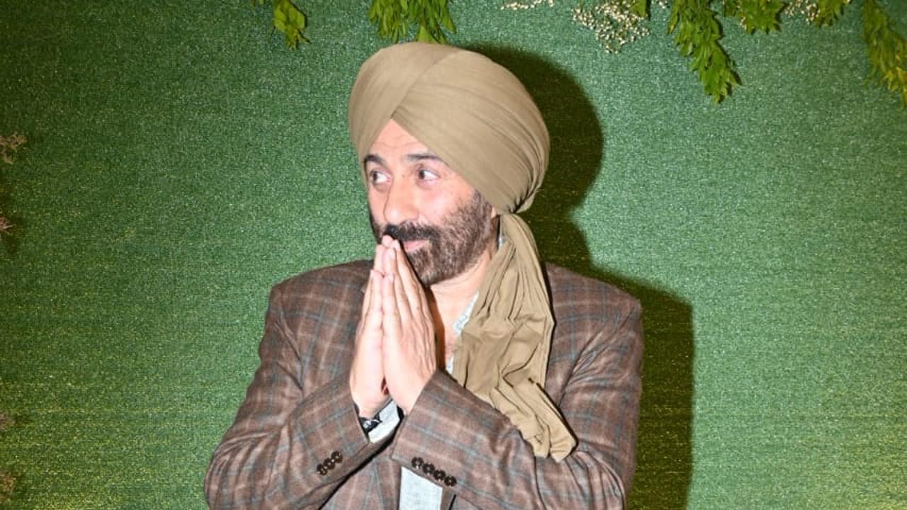 Father of the groom and actor-politician Sunny Deol grabbed eyeballs in his interesting look.
