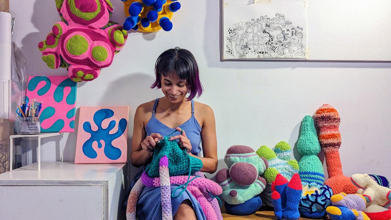 The artist uses crochet and embroidery because it holds personal significance for them as she absorbed them during her childhood in Poland and India. They have used vibrant colours in the sculptures to showcase the arrival of regenerative life forms, as well as evoke a sense of joy, celebration and vitality