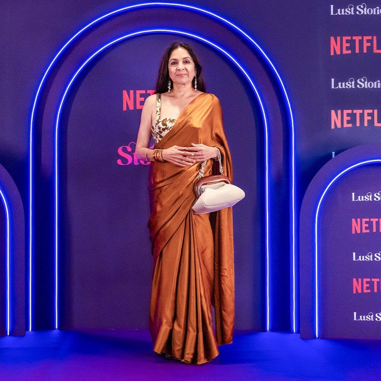 The team of 'Lust Stories 2' gathered together on Tuesday in Mumbai for the special screening of the Netflix anthology. Actress Neena Gupta who grabbed attention with her character in the trailer was seen arriving for the screening in a brown saree