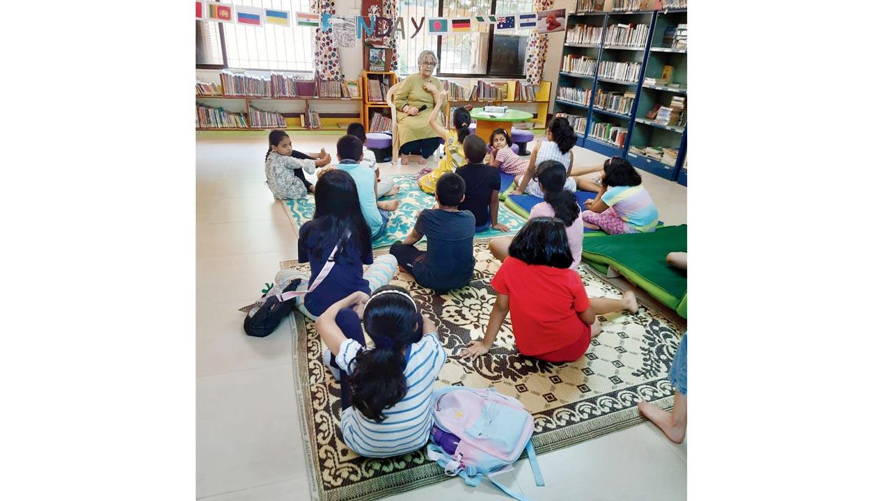 Aunty D (Debalina Ray) reading to children at MCubed Library in Bandra