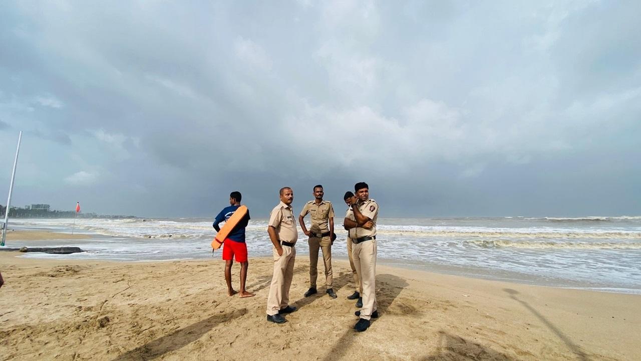 Police and lifeguards patrolling as huge  waves witnessed at Juhu beach during the storm weather after effects of  strong Cyclone Biporjoy intensified into an extremely severe cyclonic storm. Pic/Shadab Khan