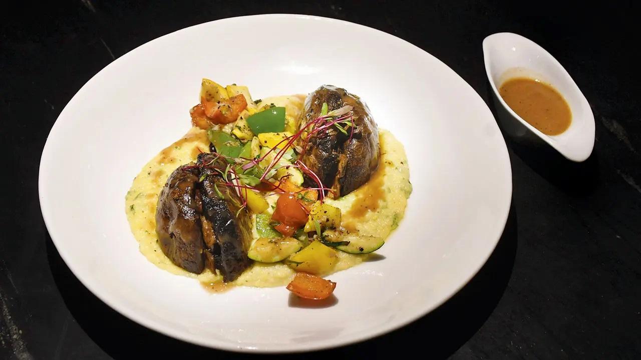 The roasted Portobello Mushroom (Rs 900) comes on a bed of polenta and crunchy veggies. A drizzle of porcini sauce served on the side ties the dish together. In Photo: Portobello mushroom