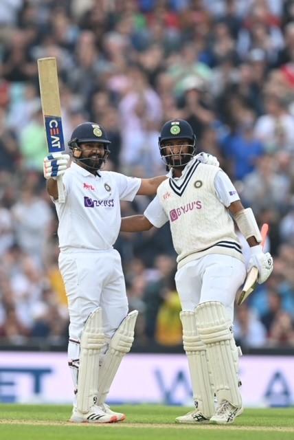 India's Rohit Sharma (left) celebrates his century with teammate Cheteshwar Pujara. PIC/AFP