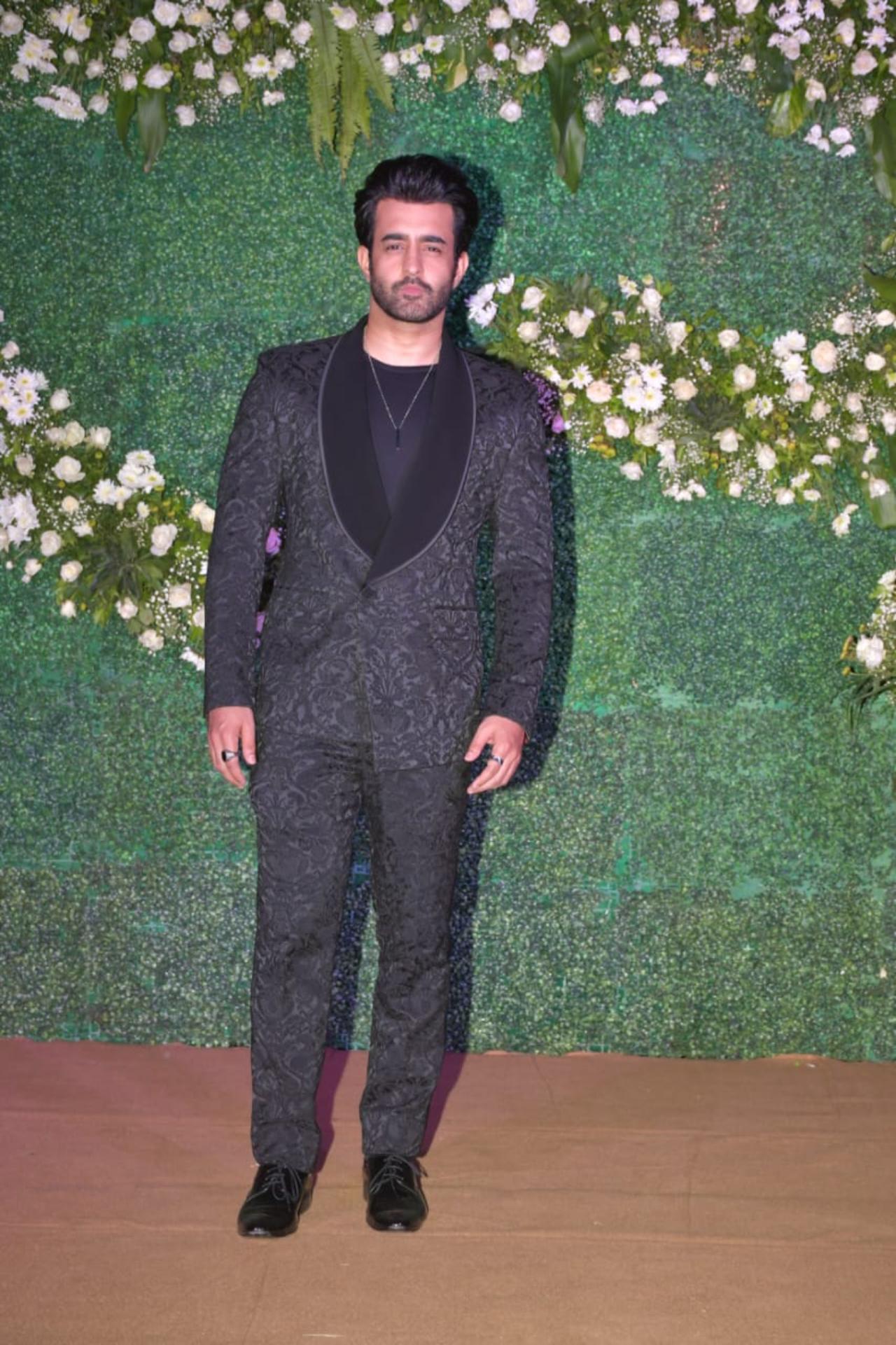 Satyajeet Dubey arrived in a black formal wear for the reception