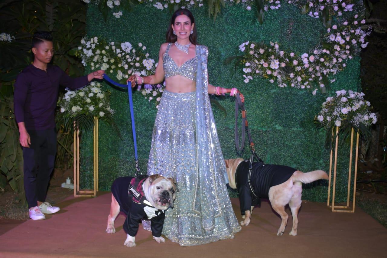 Sonnalli Seygall also posed for the shutterbugs along with her furry buddies who were in presence at the reception and also at the wedding