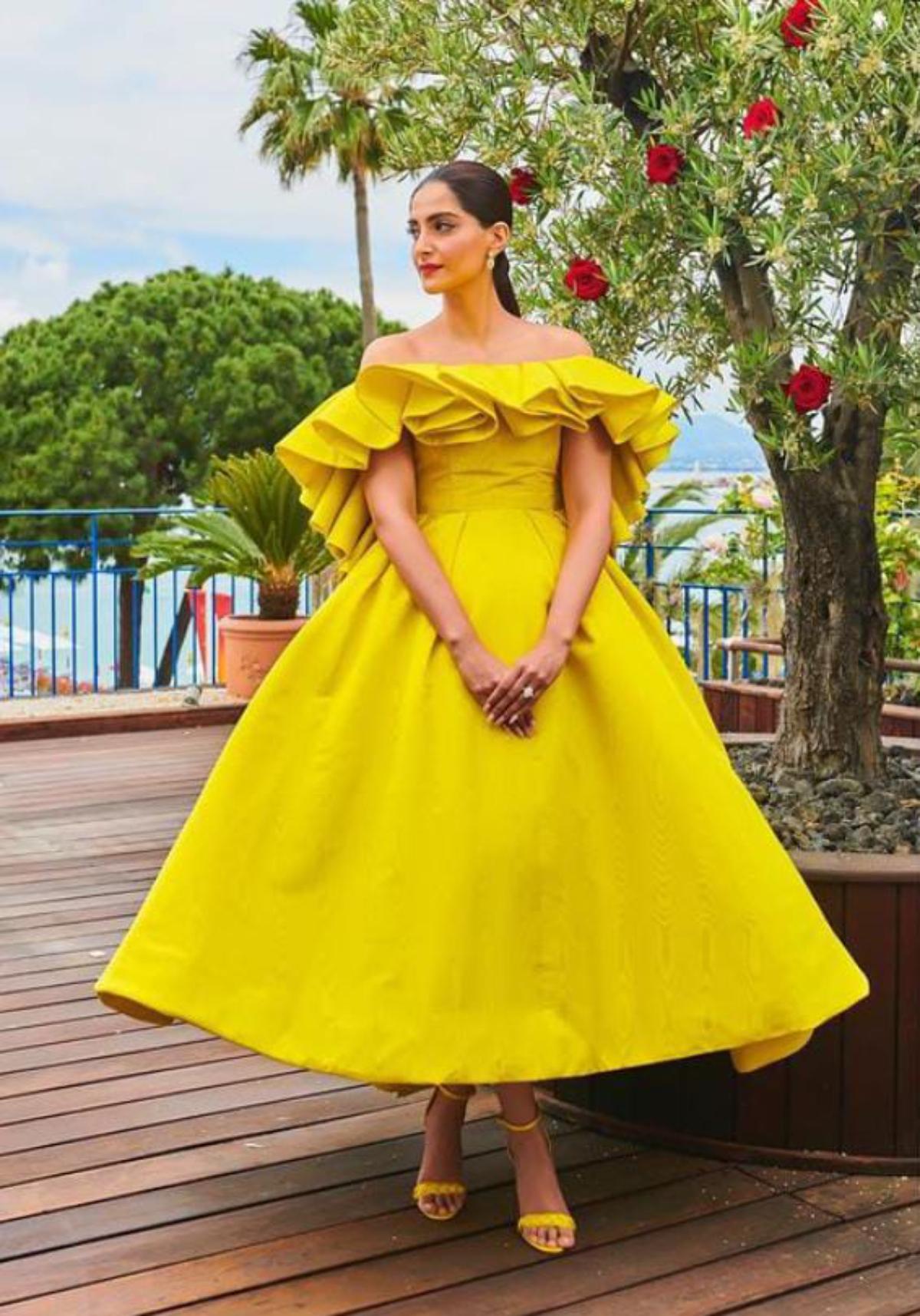 Shine bright: Bright colours alone might sometimes be enough to boost an outfit. While slaying this vivid yellow dress with ruffles, Sonam proves this in the true sense.