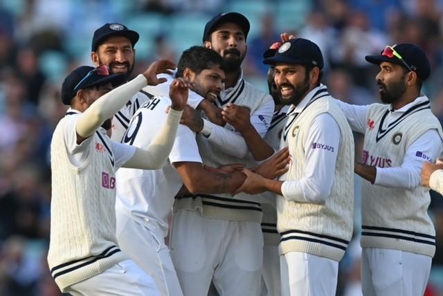 India's Umesh Yadav (third from left) celebrates Joe Root's wicket. PIC/AFP