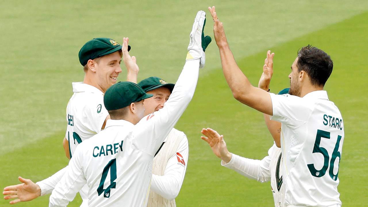 Mitchell Starc (right) celebrates with teammates after dismissing England skipper Ben Stokes. Pics/AFP