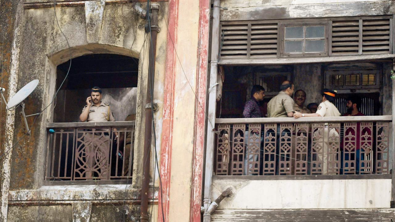 Cops at the crime scene in Parvati Mansion, at DB Marg, Grant Road,  on Friday. Pic/Ashish Raje
