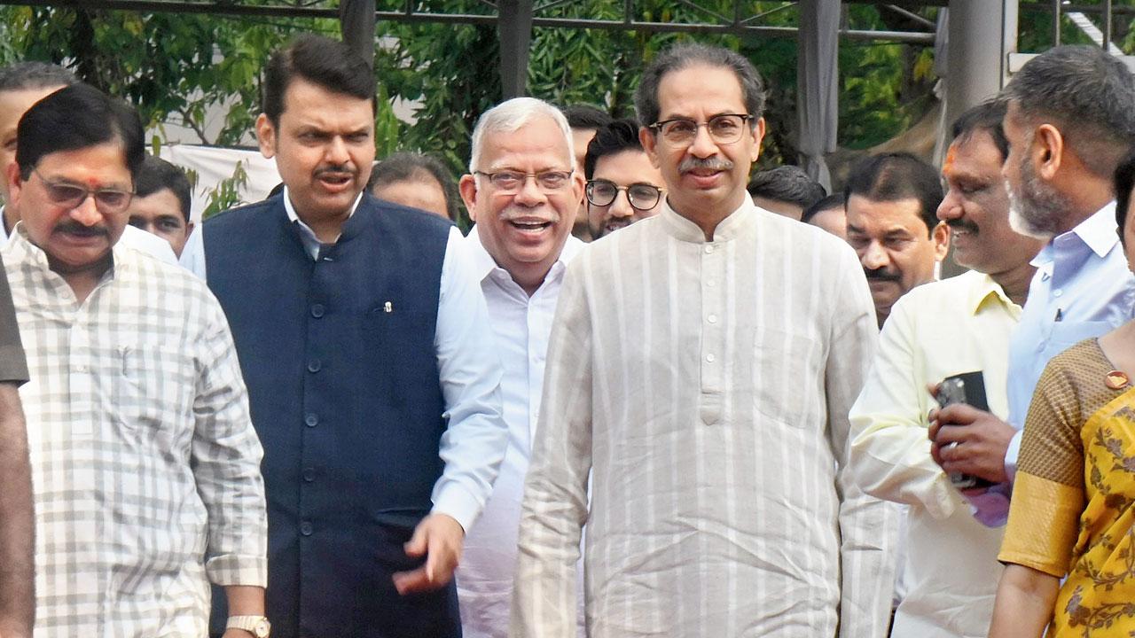 Deputy CM Devendra Fadnavis and Uddhav Thackeray as they enter Vidhan Bhavan together on Thursday. Pic/Sayyed Sameer Abedi