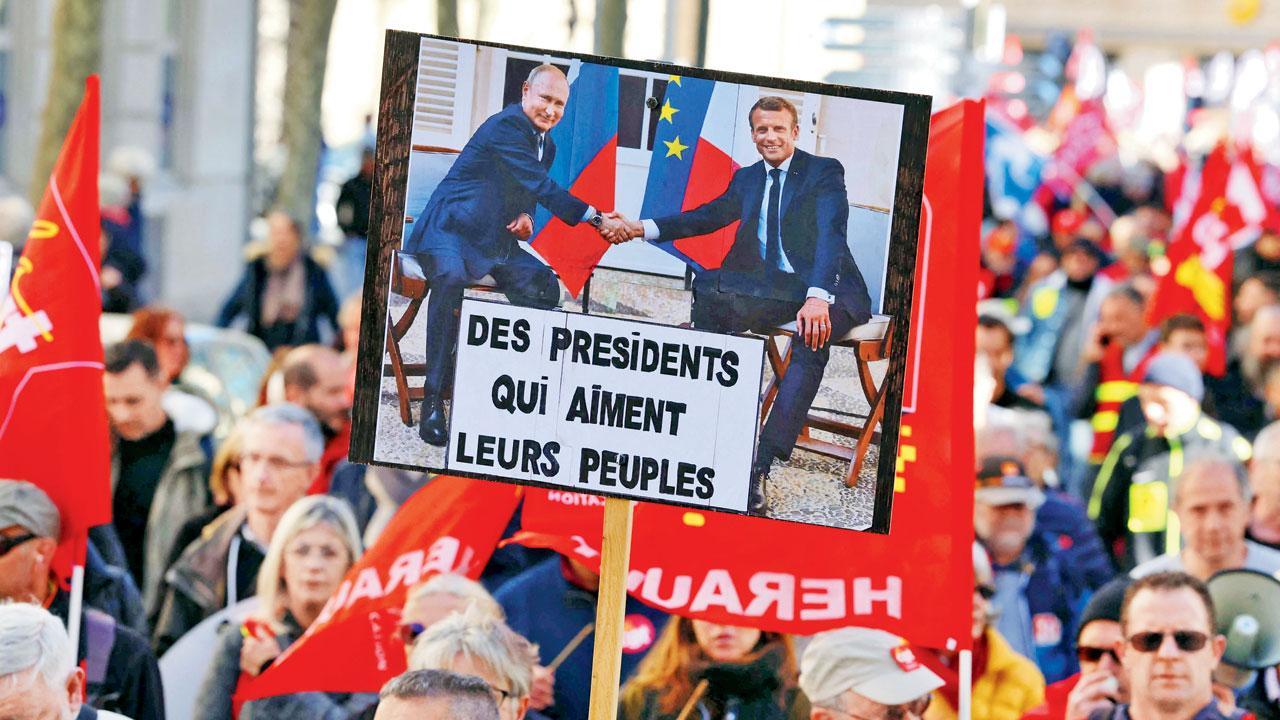 A protester holds up a banner reading, ‘Presidents that like their people’, during a demonstration in Montpellier Tuesday. Pic/AFP
