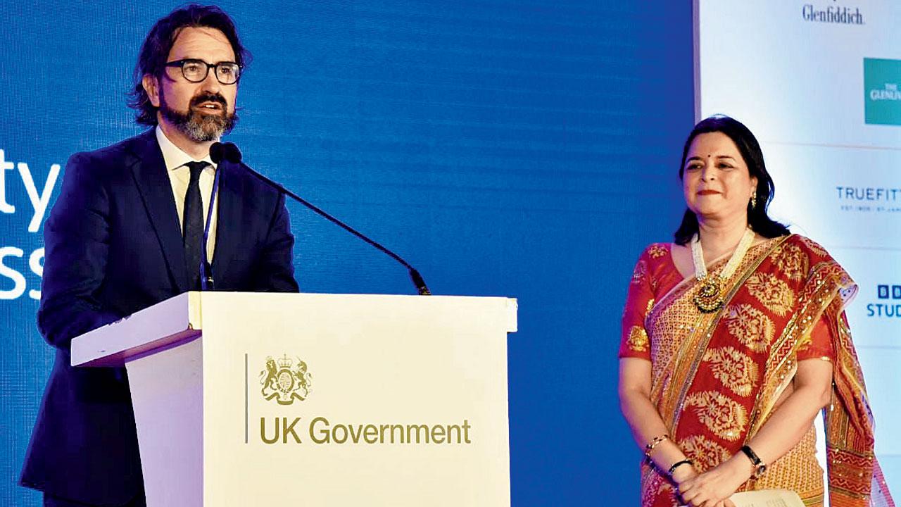 Alan Gemmell speaks at the party as Manisha Mhaiskar looks on