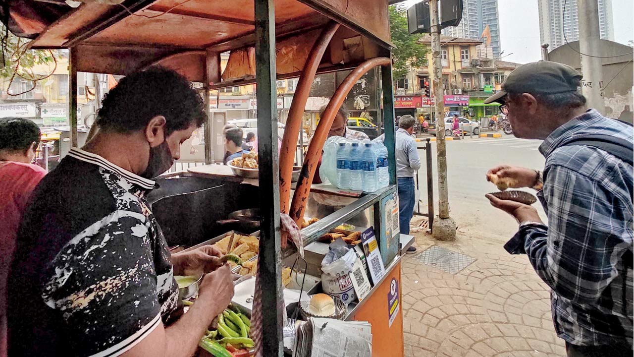 Sanjay Pawar, the vada pav vendor whose stall is opposite the Jain residence 