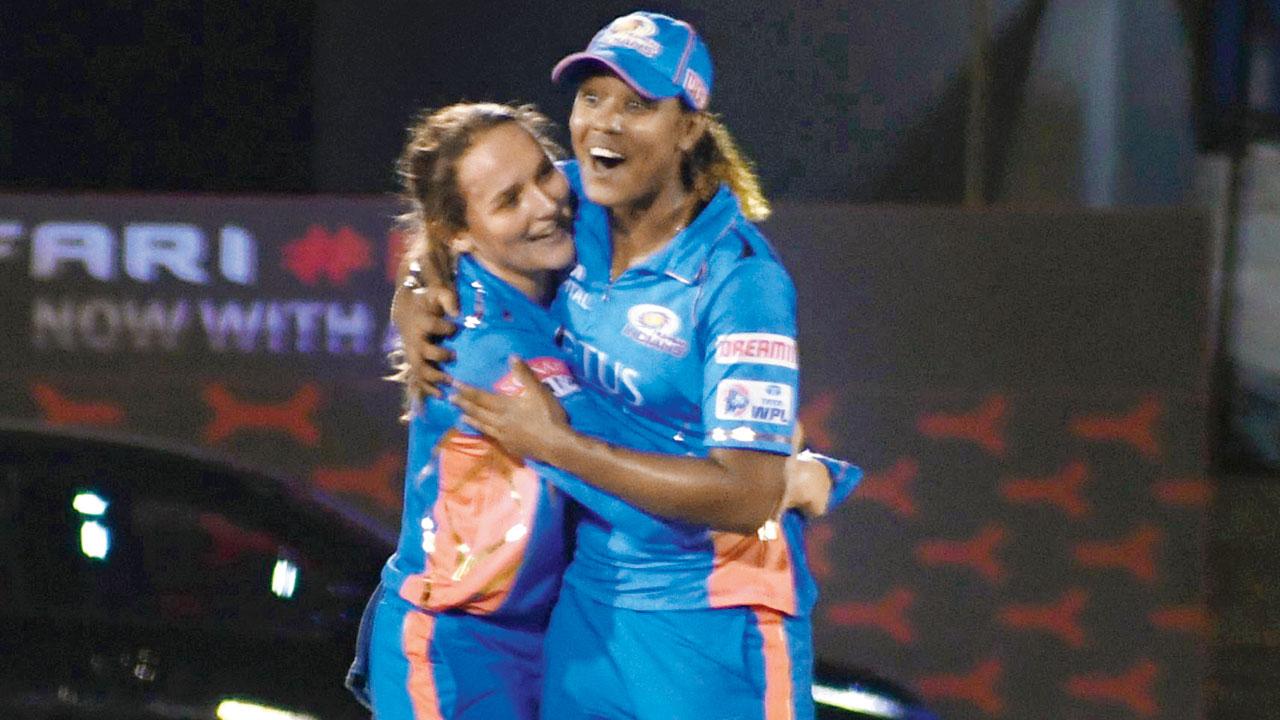 MI’s Hayley Matthews (right) and Amelia Kerr celebrate a DC wicket yesterday