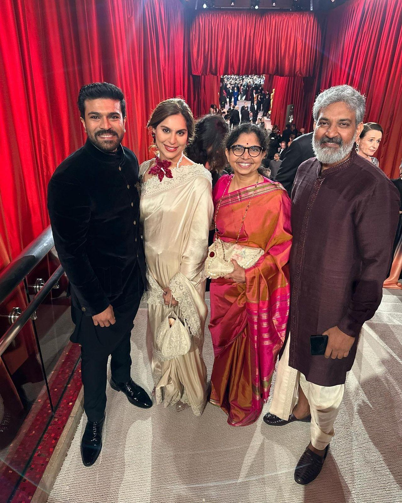 RRR director SS Rajamouli and actor Ram Charan pose with their respective spouses
