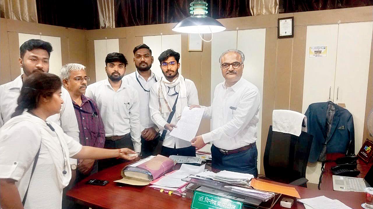 Law students submitting a written letter to Dr Vinod Patil, registrar, Kavayitri Bahinabai Chaudhari North Maharashtra University Jalgaon  on Friday