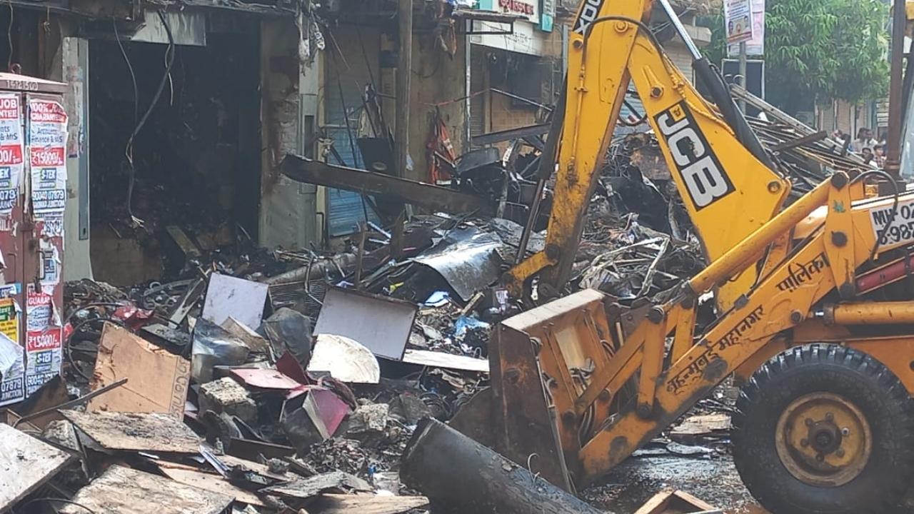 The BMC official said the loft inside the shop has collapsed posing difficulty to enter the structure following which the front portion of the structure was removed with the help of an excavator