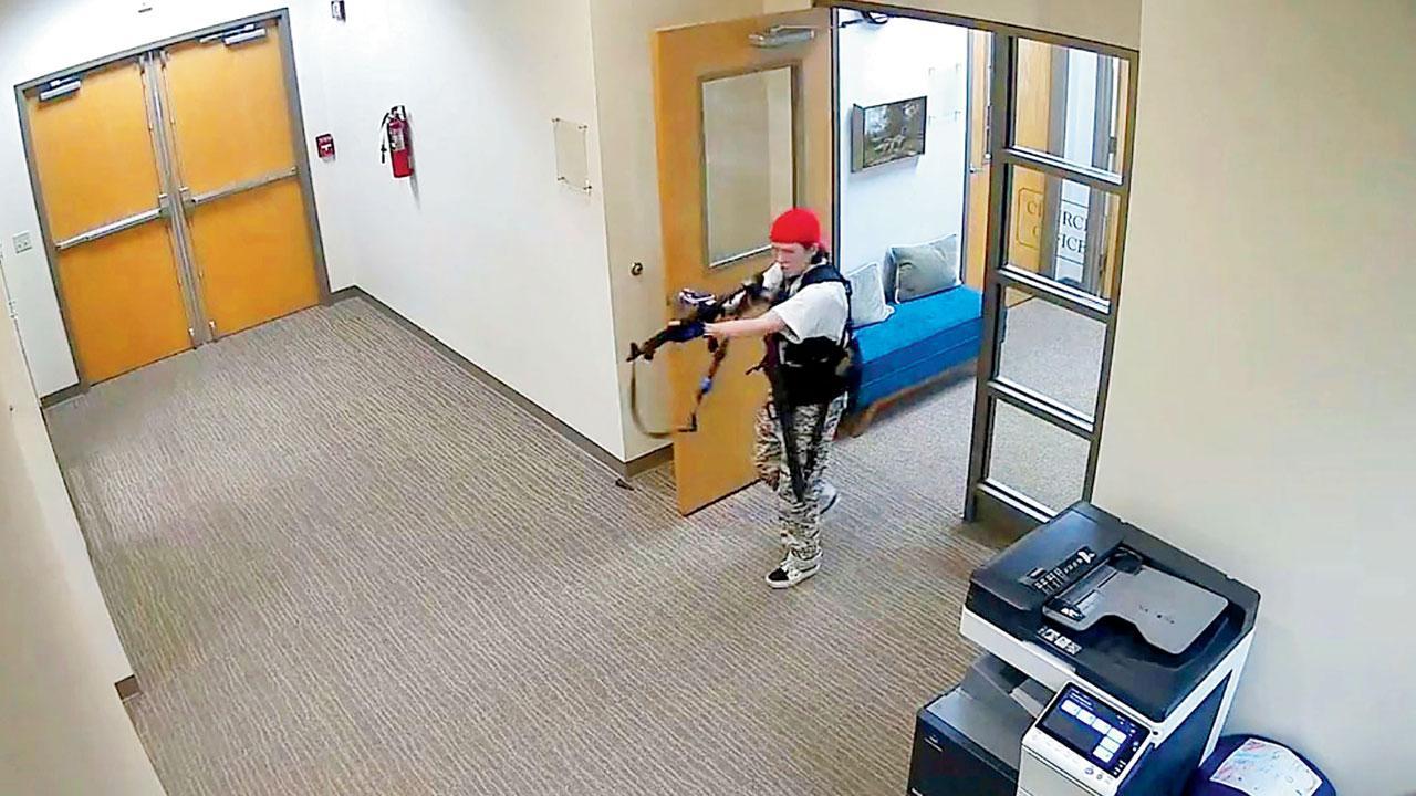 This handout video grab image courtesy the Metropolitan Nashville Police Department released Monday, shows suspect Audrey Hale holding an assault rifle at the Covenant School building. Pic/AFP