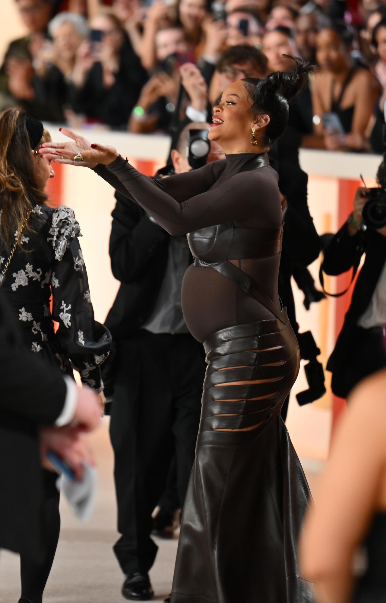 Rihanna flaunted her baby bump in a striking black gown