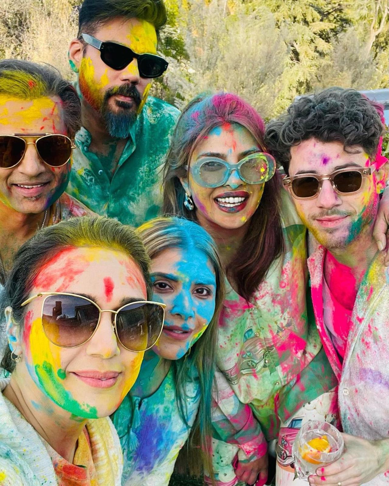In one of the pictures, Preity and Gene could be seen posing with Nick, Priyanka, and other guests smeared in gulaal