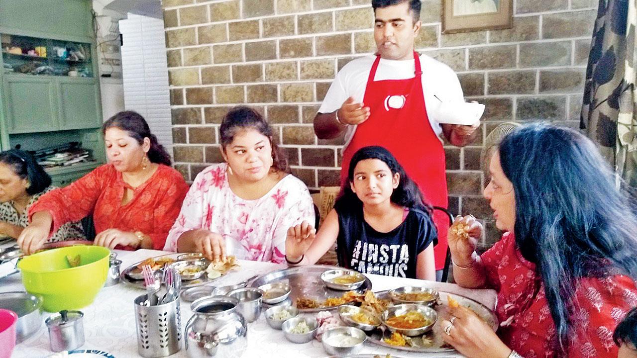 Diners enjoy a meal by Talpade