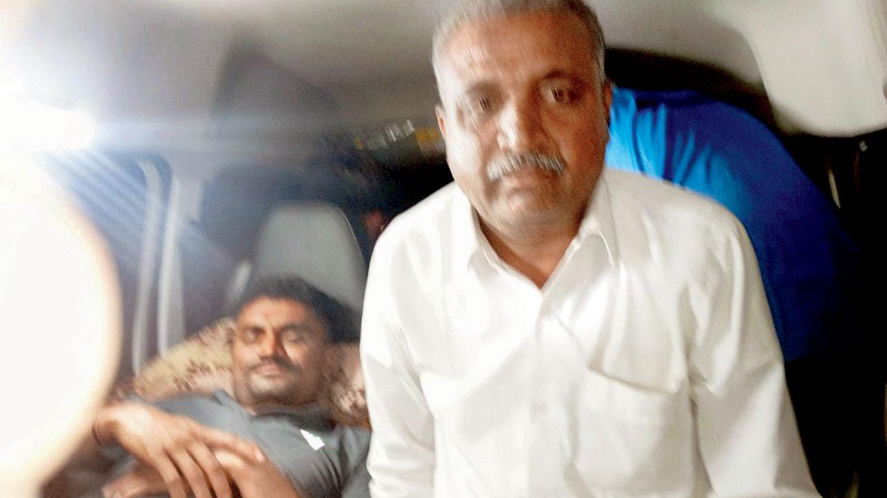 Aspiring constable Dinesh Patil and his father Kailash in the ambulance