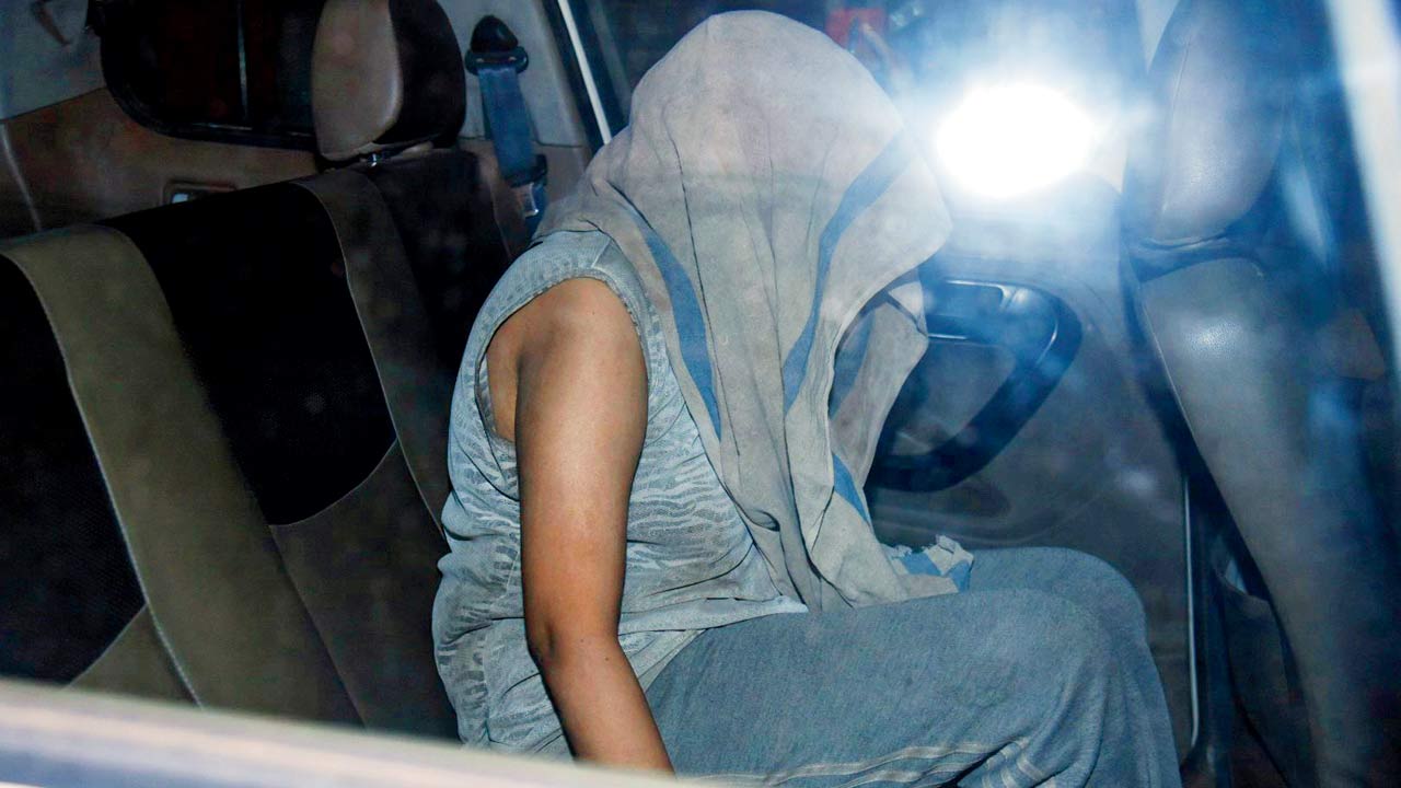 Rimple Jain is taken into police custody on Tuesday night. Pic/Ajinkya Sawant