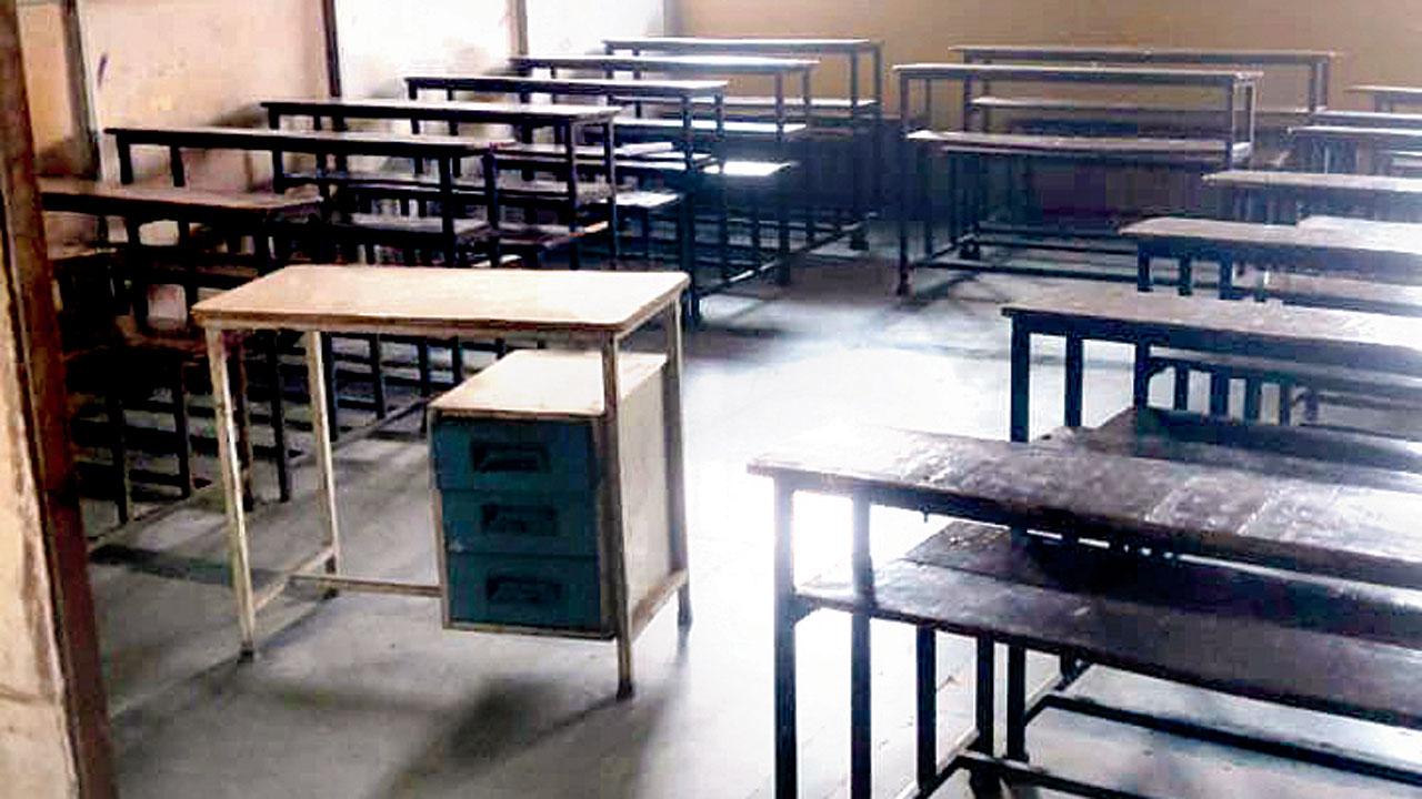 A classroom with narrow benches and desks and an asbestos roof that makes the room extremely hot