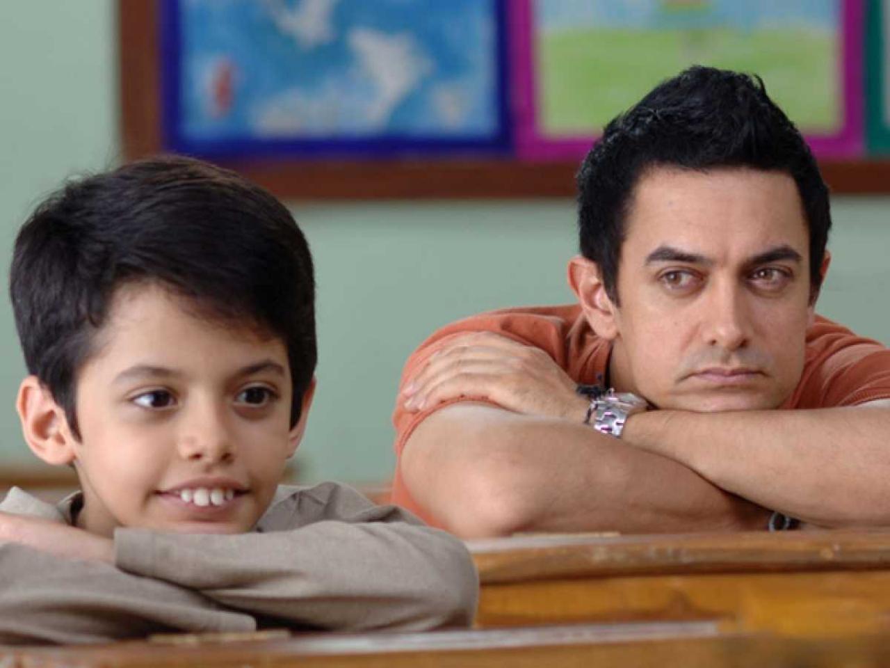 'Taare Zameen Par' (2007) tells the tale of a dyslexic child 'Ishaan' (Darsheel Safari) who is sent to a boarding school for his poor academic performance by his extremely critical parents. Ram (Aamir Khan), an art teacher, recognizes 'Ishaan''s struggle and helps him navigate his way through school. The film was directed by Aamir Khan and Amole Gupte.