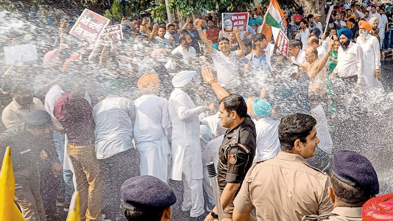 Congress protesters face arrests, water cannon