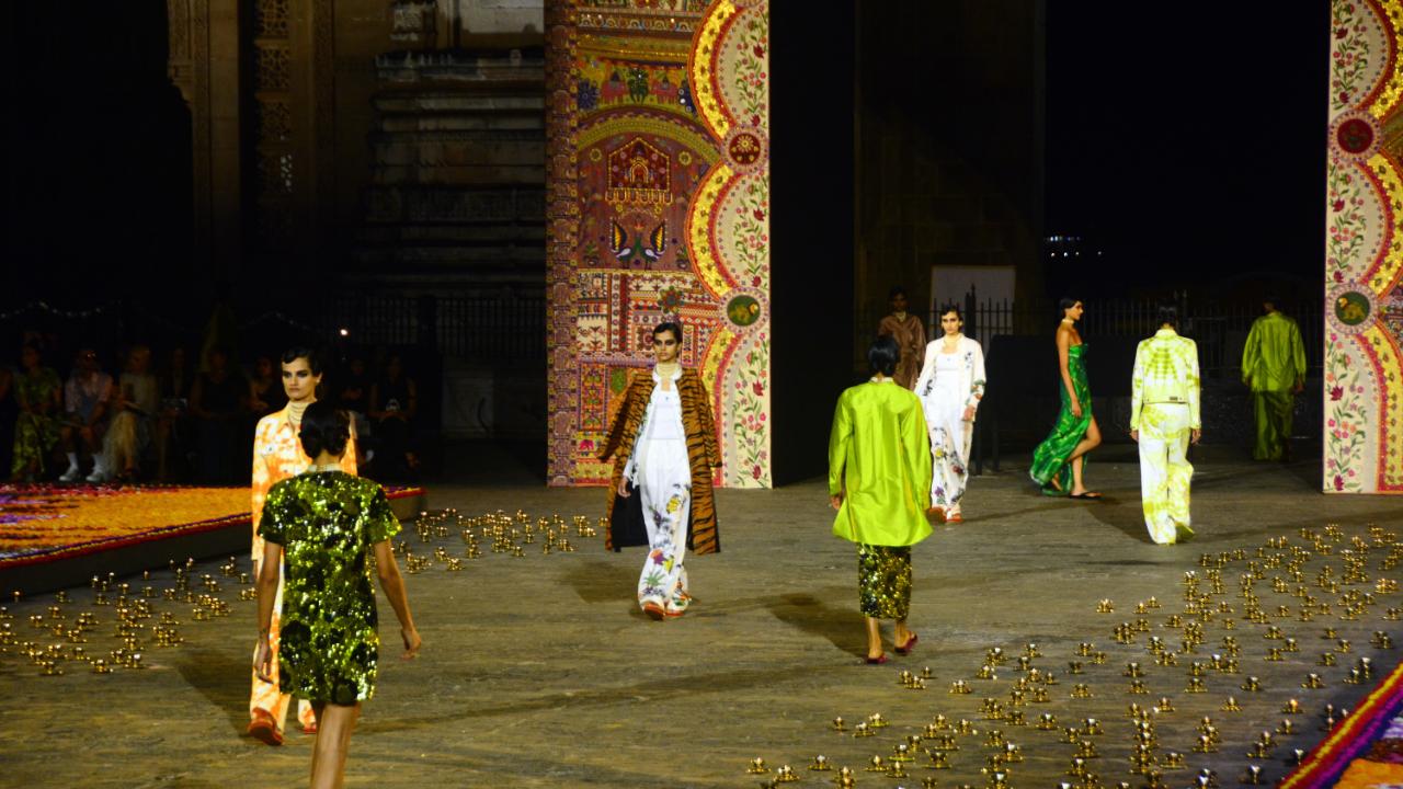 The runway was adorned with marigold flowers and diya lamps. The models sported fashion garments that had Banarasi brocade fabrics, tye dies, mirror work and Nehru collars to represent India's eclectic fashion culture