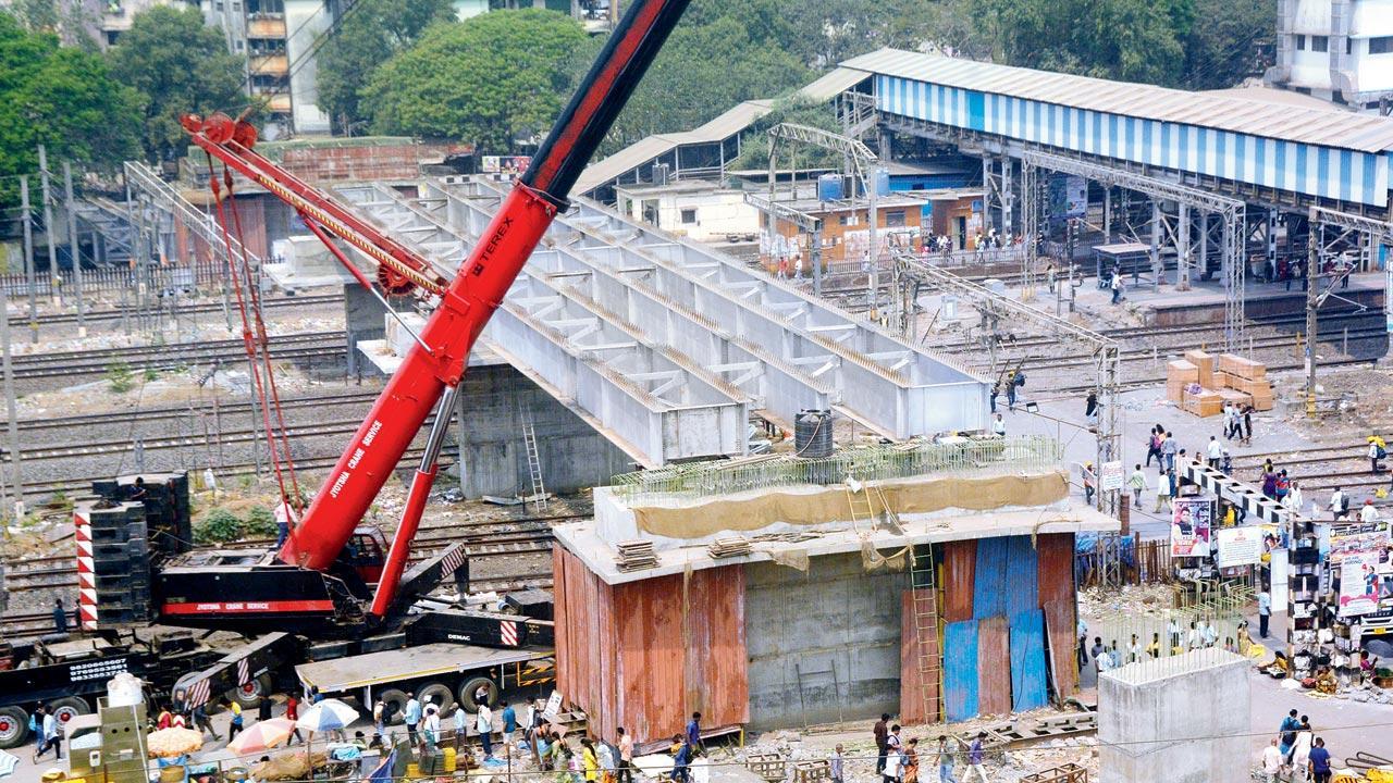Thane: Two sets of girders mounted atop Diva station overbridge