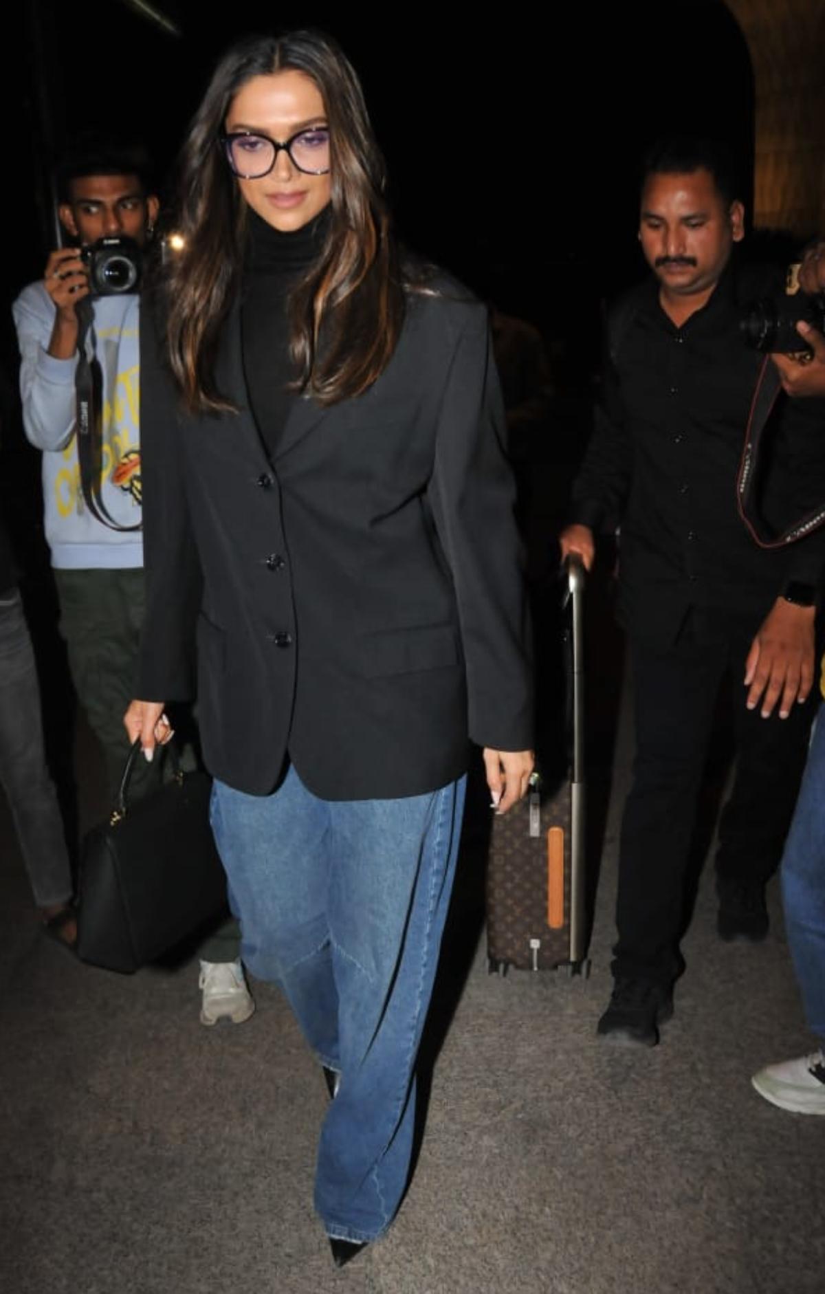 The towering diva who makes her fans go gaga with her bewitching beauty, magical persona and flawless fashion sense, never goes wrong when it comes to airport looks. While leaving for the USA, DP looked no less than a beautiful boss lady as she walked off at the airport wearing a chic black blazer and the classic, blue oversized denim. 