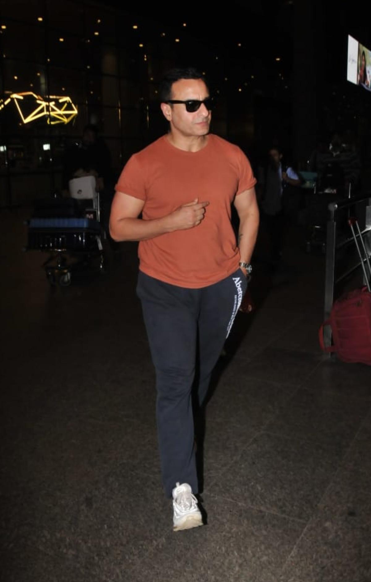 Meanwhile, Kareena's actor-husband, Saif Ali Khan kept it simple with a basic rust orange t-shirt and slightly printed black track pants. Like her wife, the 'Omkara' star completed his airport look with white sneakers and black sunglasses. 
