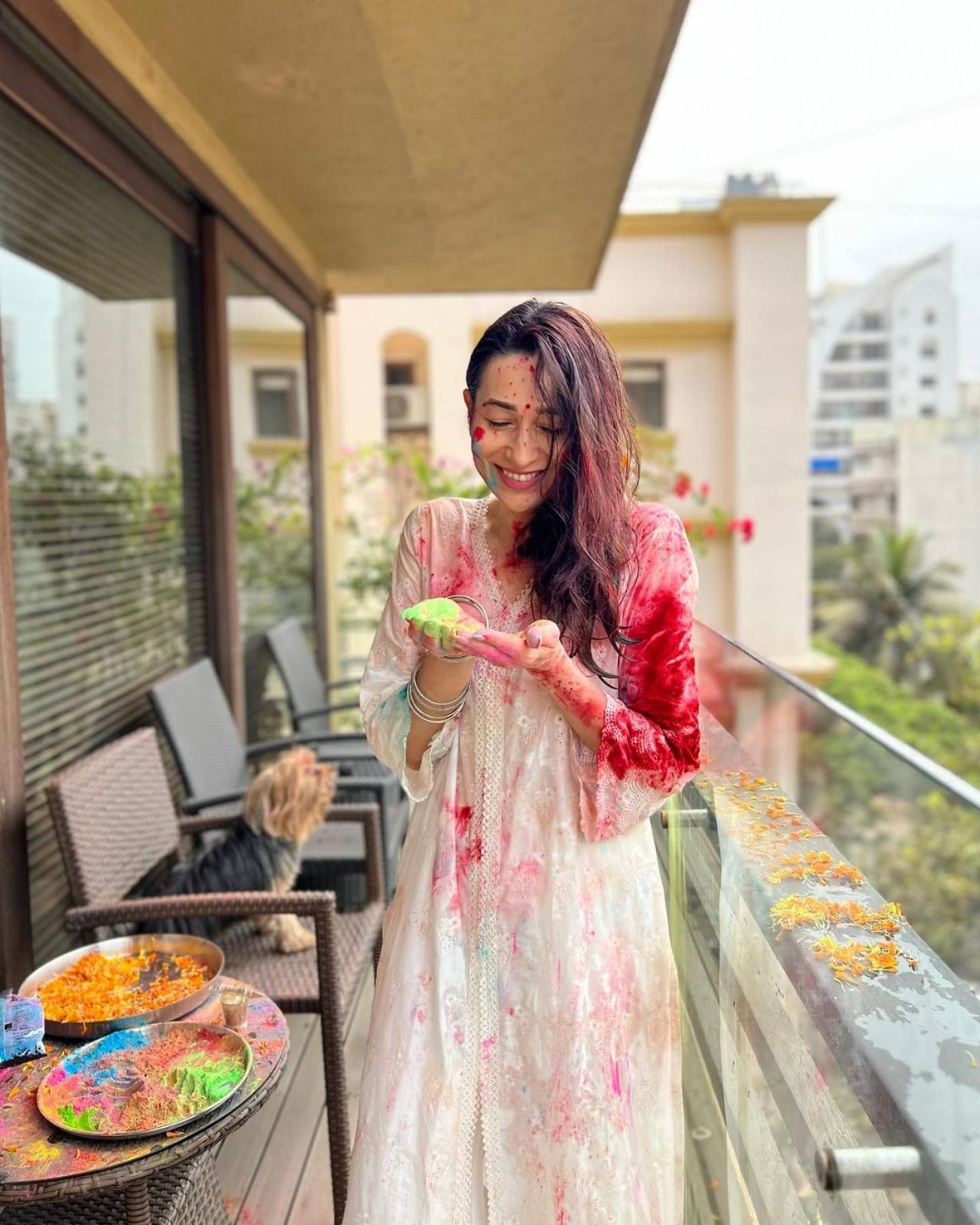 Karisma Kapoor defined self love as she shared a couple of pictures of herself enjoying the colours of Holi at the balcony of her home