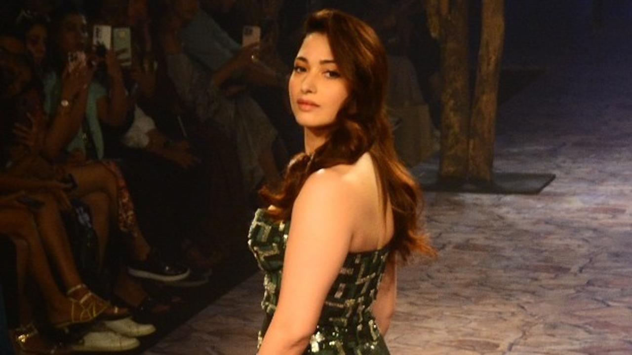 Tamannaah Bhatia presented a creation by designer Nirmooha. The actress commanded attention in her printed gown with a back slit. 