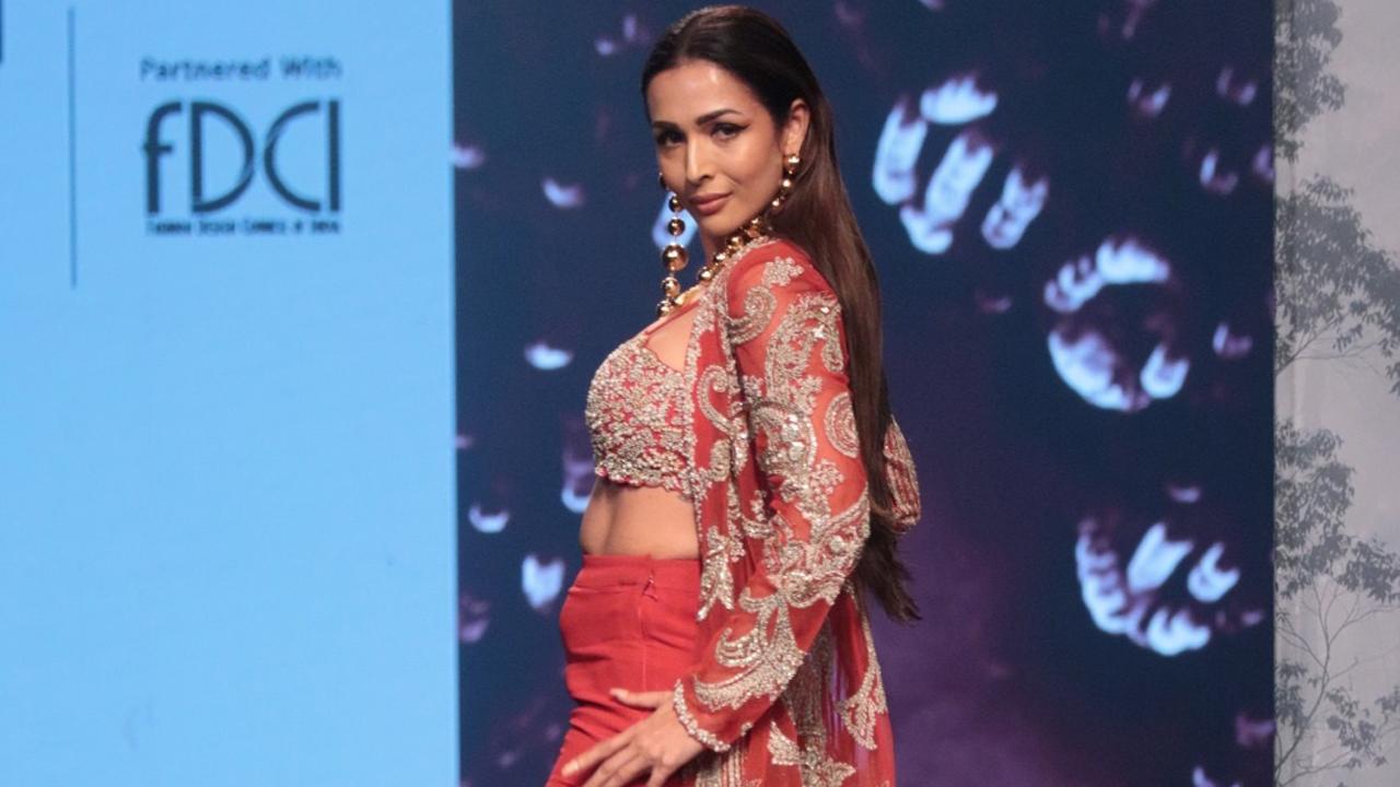 The stunner actress, model and dancer Malaika Arora took to the ramp for Bhumika Sharma. Afterall isn't orange the new black?