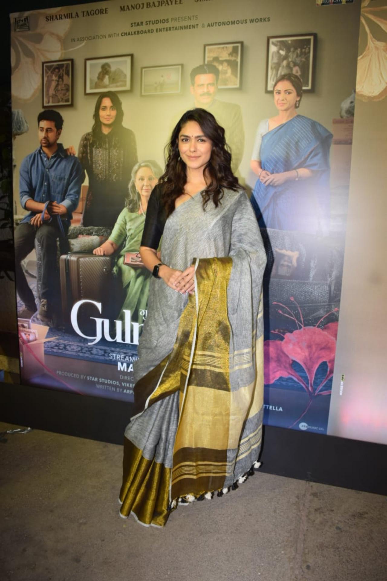 Mrunal Thakur was seen wearing an elegant grey and golden saree, accompanied by a black blouse. The 'Jersey' star rounded off her ethnic look with a little black bindi and for the hair-do she opted for some soft curls.
