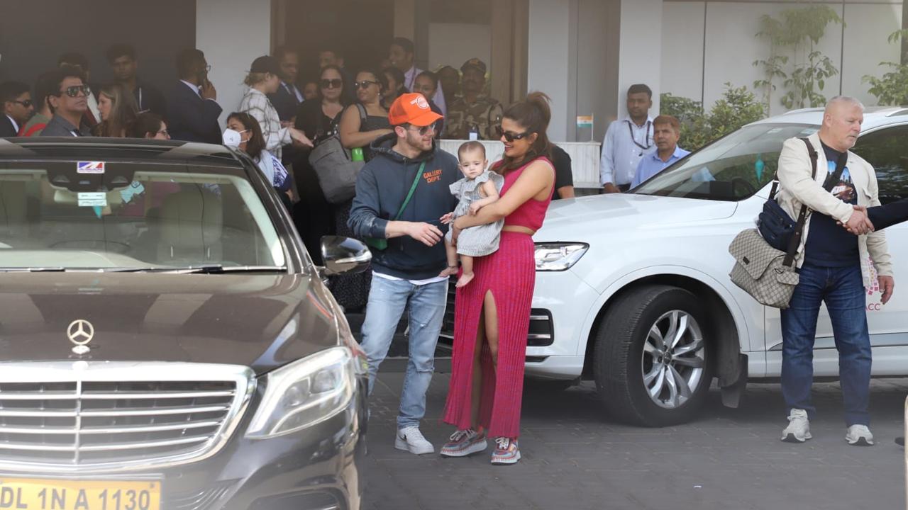 While Nick opted for a casual look, a hoodie with denims and a cap, Priyanka was at her stylish best in hot pink co-ords. Nick's sling bag caught attention.