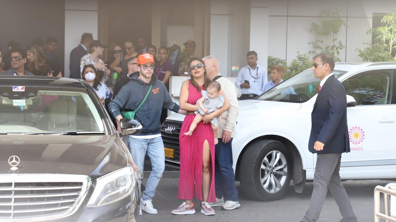 The actress held baby Malti Marie close as the trio posed for the paparazzi. Malti Marie wore a cute grey dress.