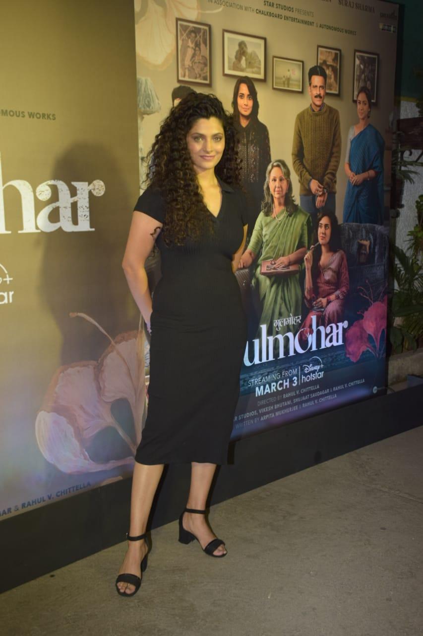 Saiyami Kher was spotted wearing a simple black midi dress with some black block heels and rocking her natural curly hair. 