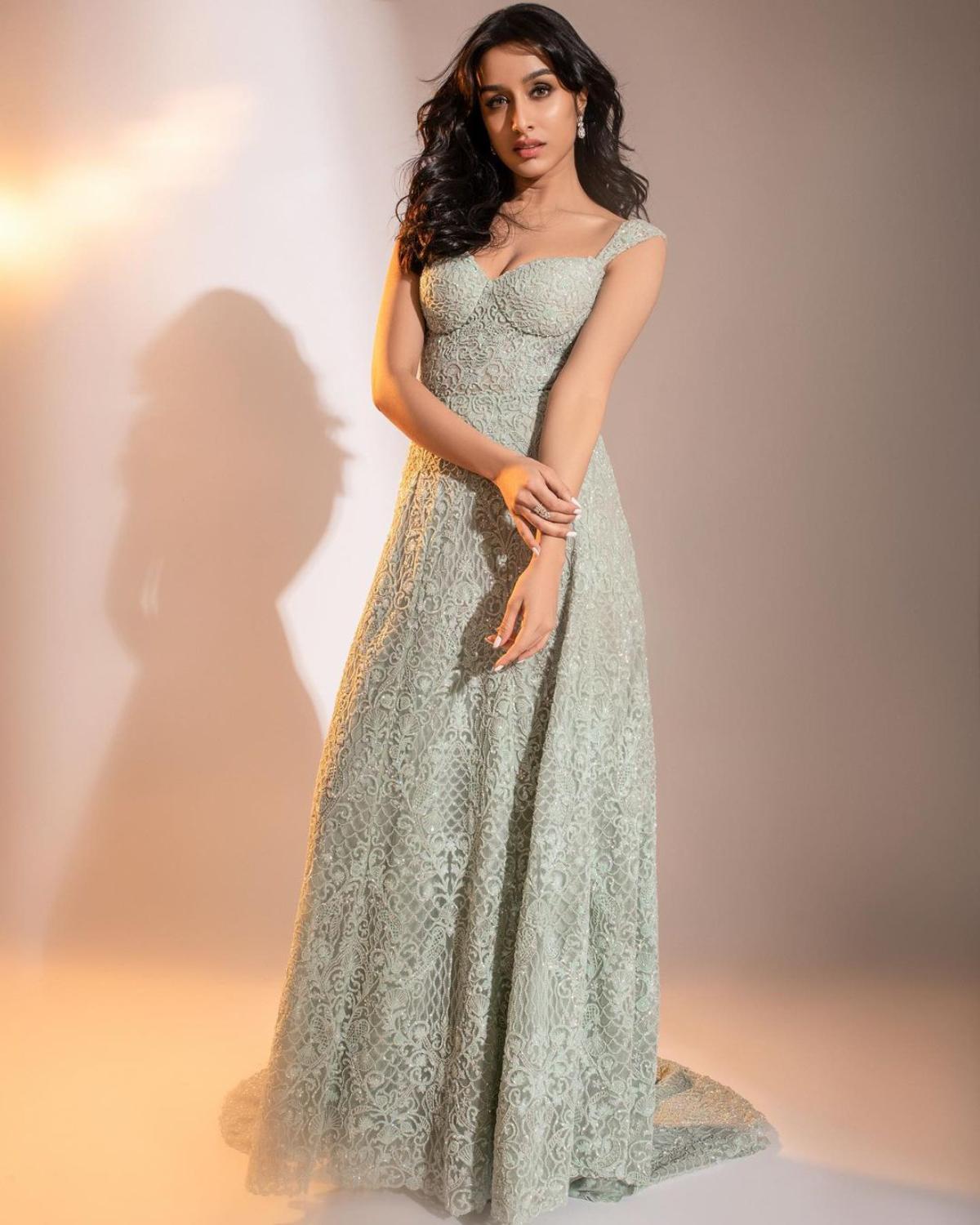 The 'Stree' star looks magical as she dons an alluring light ash green gown with innate elan. The unique colour of the gown and the intricate embroidery work along with slight embellishments makes her ensemble stand out. Despite the 'no-jewellery' look, Shraddha looks resplendent as she shines with her natural glow which adds the beauty of her otherwise pal-looking gown. 