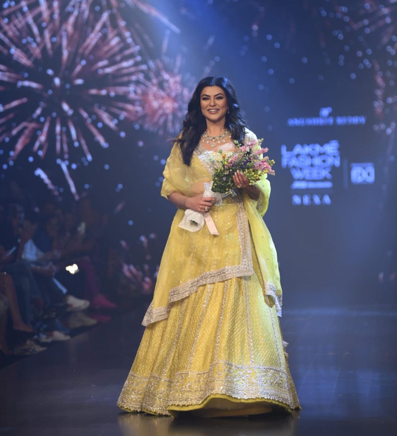 1994's Miss Universe Sushmita Sen who recently survived a heart attack, made a strong comeback at the Lakme Fashion Week in a gorgeous pastel yellow lehenga, holding a bouquet of flowers. Sen's lehenga was complimented with a delicate, yet extravagant emerald and silver neckpiece. Sushmita walked as a show-stopper for the designer Anushree Reddy. (Pic/ Yogen Shah)