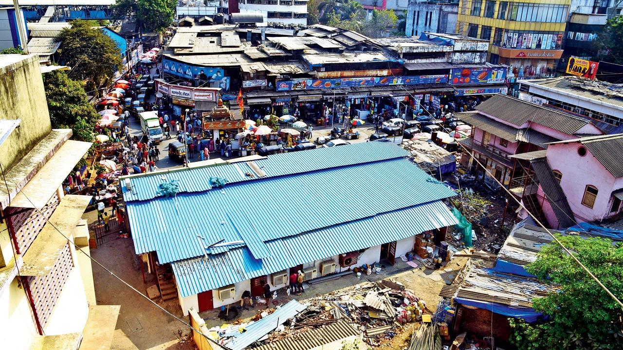 The BMC on February 2 tore down the residential portion of Krishna Baug (with blue shed), which was tagged C1, but left the ground floor shops intact. Pic/Nmesh Dave