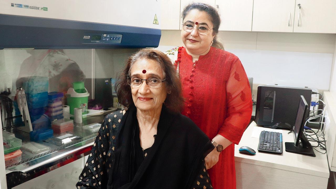 CPAA CEO Alka Sapru Bisen (in red) and Dr Dhananjaya Sarnath, executive director, research studies, at the non-profit’s Mahalaxmi lab where samples are screened for HPV infection. Pic/Anurag Ahire