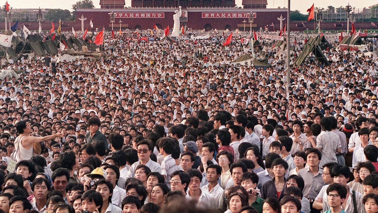 People gather in Tiananmen Square around a 10-metre replica of the Statue of Liberty (C), called the Goddess of Democracy, demanding democracy despite martial law in Beijing on June 2, 1989.
