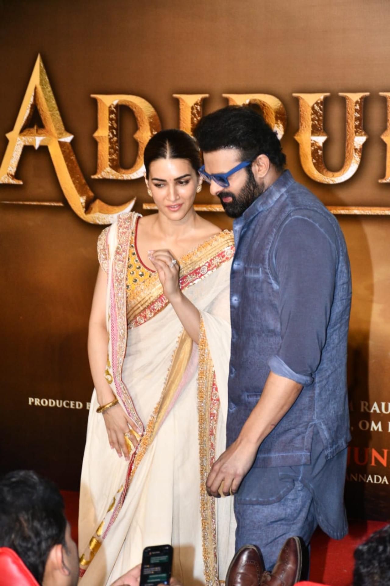 Lead stars Prabhas and Kriti Sanon share a candid moment at the trailer launch. Prabhas plays the role of Lord Ram in Adipurush, while Kriti Sanon plays Goddess Sita. (Photo: Yogen Shah)